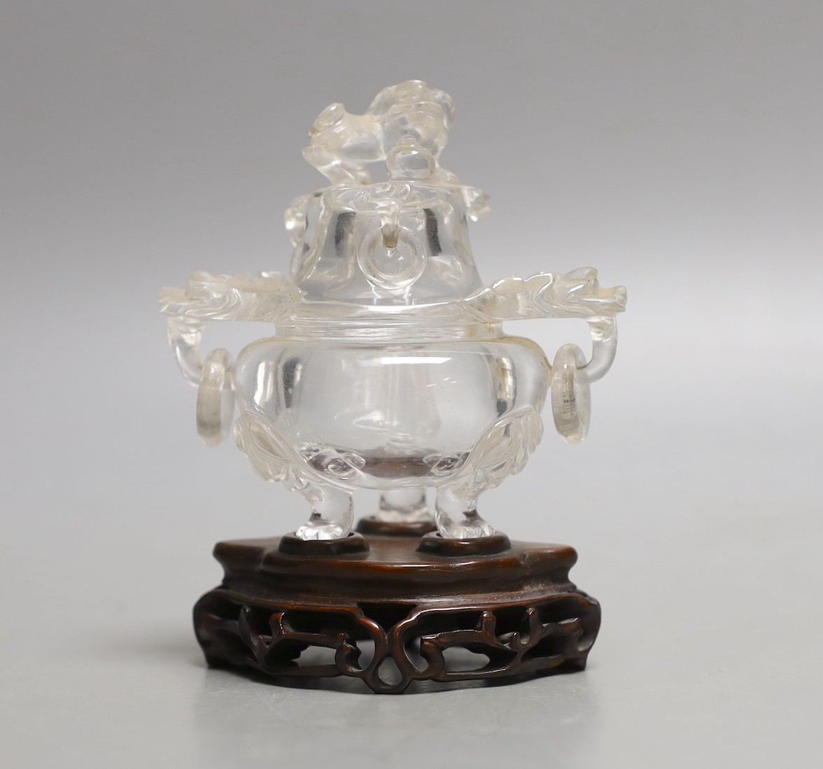 A Chinese rock crystal tripod censer and cover, on hardwood stand, 11cm